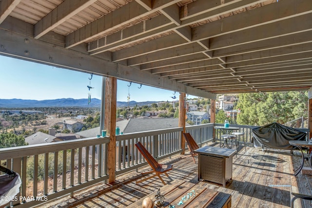 wooden deck with a mountain view