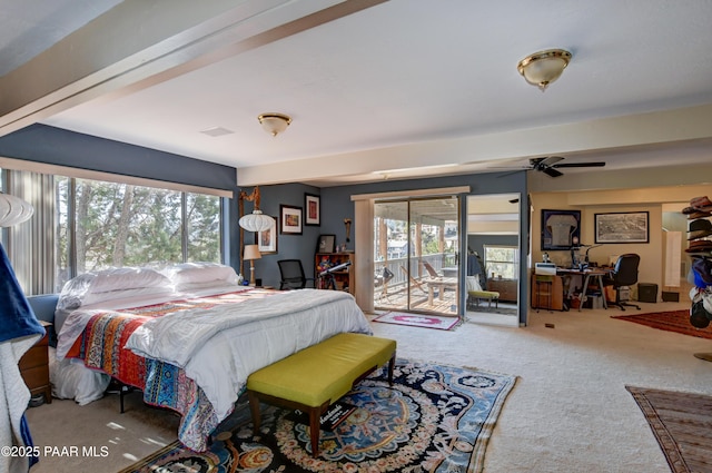 carpeted bedroom featuring multiple windows and access to outside