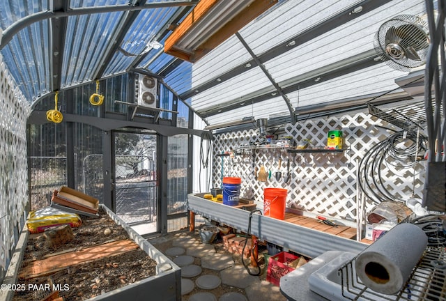 sunroom featuring lofted ceiling