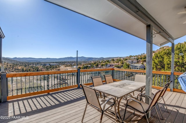 deck with a mountain view and ceiling fan