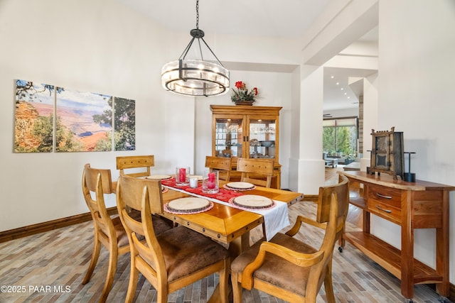 dining space featuring a chandelier and light hardwood / wood-style floors