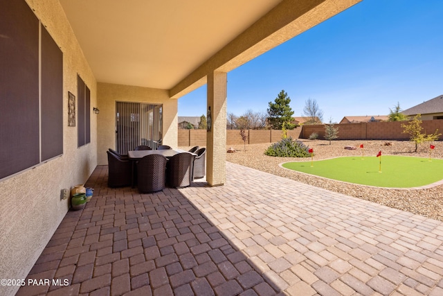 6543 E Falon Ln, Prescott Valley, AZ 86314 - fenced backyard with a putting green, a patio, and outdoor dining space