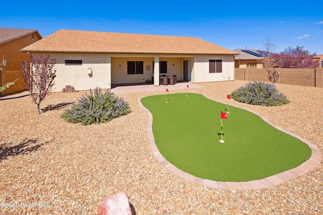 6543 E Falon Ln, Prescott Valley, AZ 86314 - rear view of house featuring a putting area, stucco siding, a patio area, and a fenced backyard