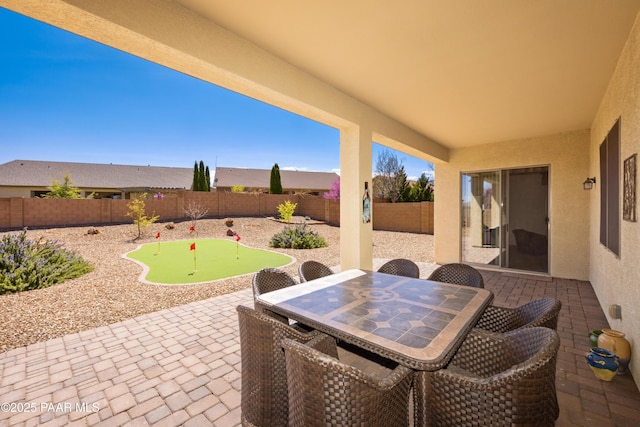 6543 E Falon Ln, Prescott Valley, AZ 86314 - fenced backyard with a putting area, a patio, and outdoor dining area