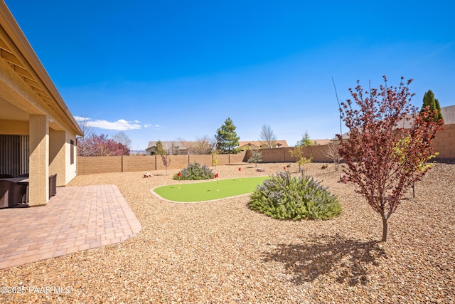 6543 E Falon Ln, Prescott Valley, AZ 86314 - fenced backyard with an area to practice putting and a patio area