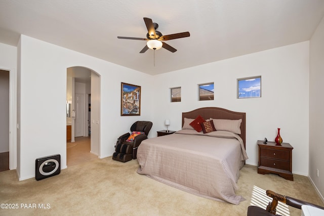 6543 E Falon Ln, Prescott Valley, AZ 86314 - bedroom featuring arched walkways, light colored carpet, and a ceiling fan