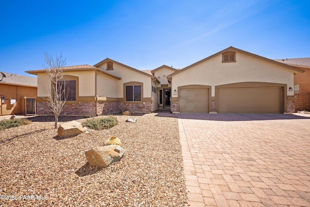 6543 E Falon Ln, Prescott Valley, AZ 86314 - view of front of property featuring stucco siding, stone siding, an attached garage, and decorative driveway