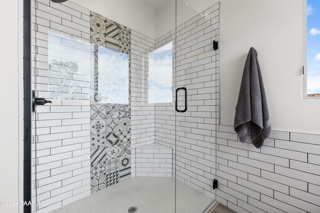 full bathroom featuring a shower stall