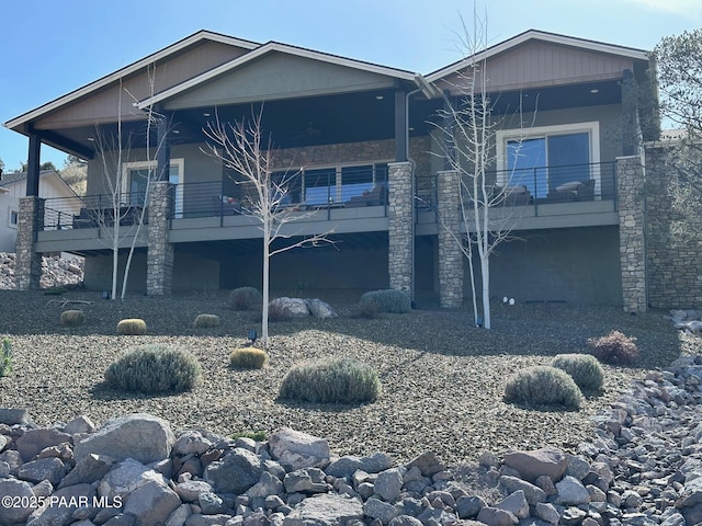 back of property with stone siding