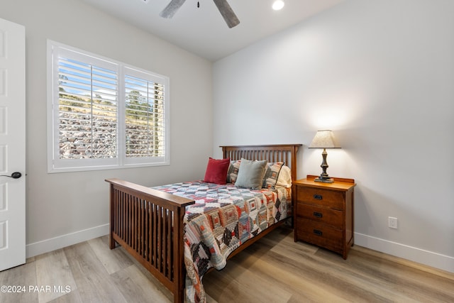 bedroom with light wood finished floors, recessed lighting, a ceiling fan, and baseboards