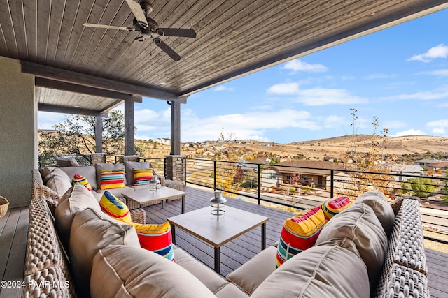 balcony with outdoor lounge area and a ceiling fan