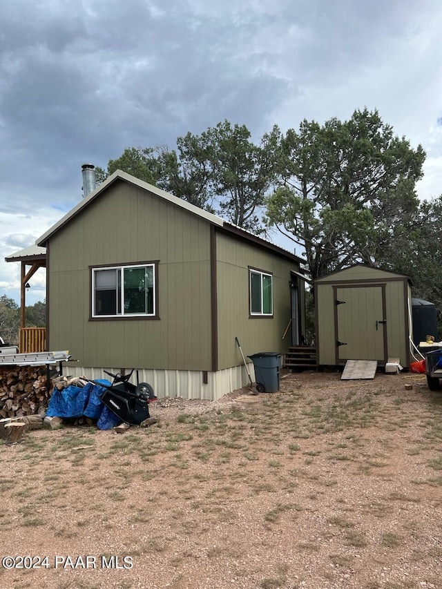 view of home's exterior featuring a shed