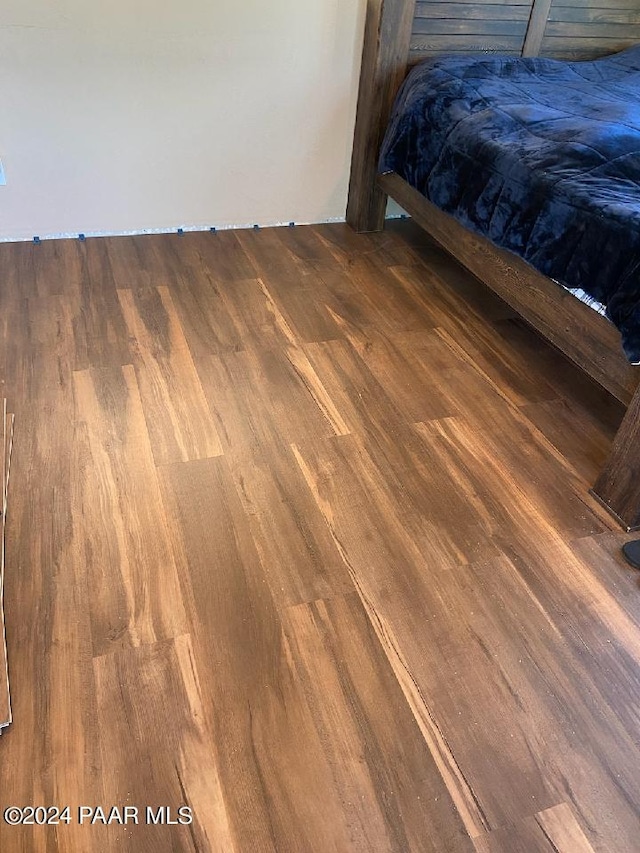 unfurnished bedroom featuring hardwood / wood-style flooring