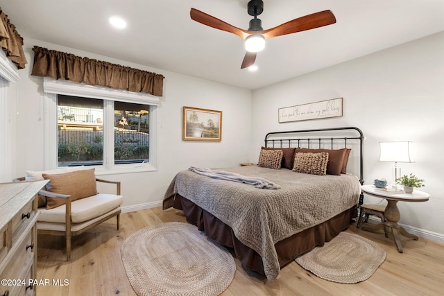 bedroom with ceiling fan and light wood-type flooring