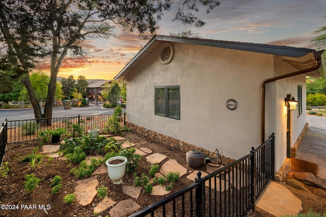 view of property exterior at dusk