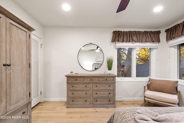 bedroom with ceiling fan and light wood-type flooring