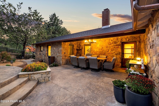 view of patio terrace at dusk