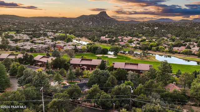 aerial view at dusk with a water and mountain view