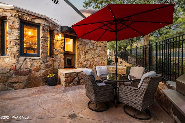 view of patio terrace at dusk