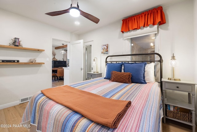 bedroom featuring ceiling fan and light hardwood / wood-style floors