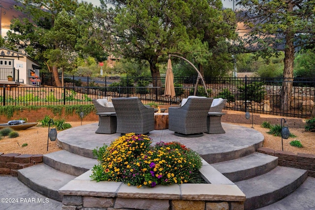 view of patio terrace at dusk