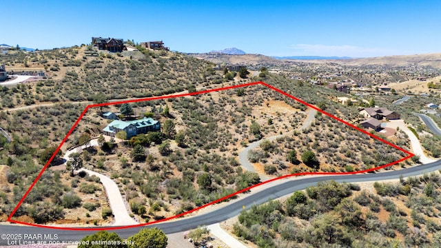 aerial view featuring a rural view, a desert view, and a mountain view