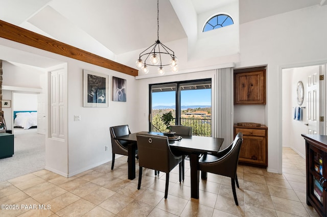 dining area featuring high vaulted ceiling, baseboards, a notable chandelier, and light tile patterned floors