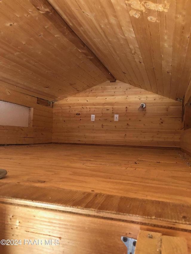 additional living space featuring lofted ceiling with beams and wood ceiling