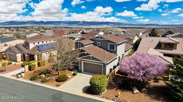 drone / aerial view featuring a mountain view