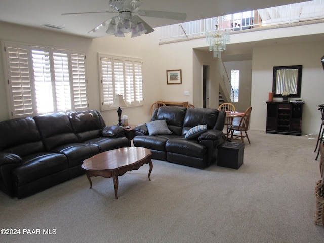 living room featuring ceiling fan and light carpet