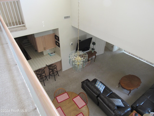 living room featuring a towering ceiling