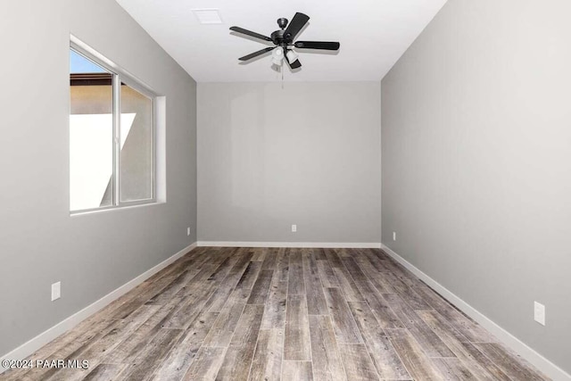 spare room featuring ceiling fan and hardwood / wood-style floors