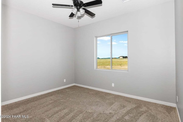 spare room with carpet flooring and ceiling fan