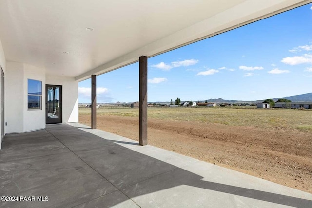 view of patio / terrace featuring a mountain view