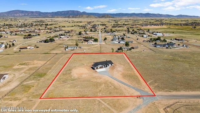 birds eye view of property featuring a mountain view