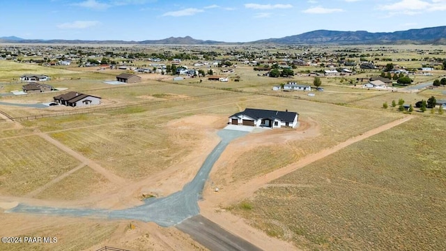 birds eye view of property with a mountain view