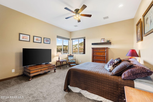 carpeted bedroom featuring ceiling fan