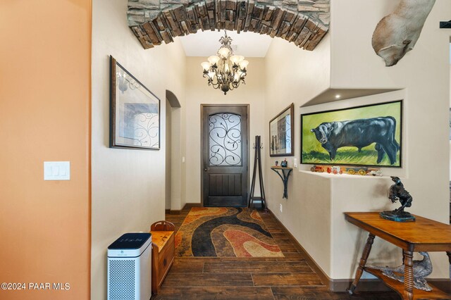 9757 N Heartland Dr, Prescott Valley, AZ 86315 - entryway featuring wood finished floors, a chandelier, and arched walkways
