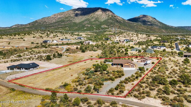 9757 N Heartland Dr, Prescott Valley, AZ 86315 - aerial view of property and surrounding area featuring property parcel outlined and a mountainous background