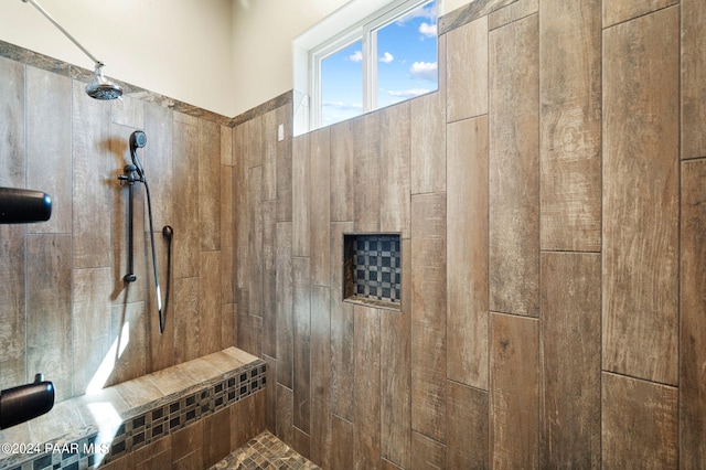 bathroom with a tile shower