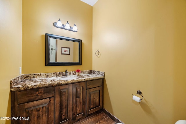 bathroom with hardwood / wood-style floors and vanity