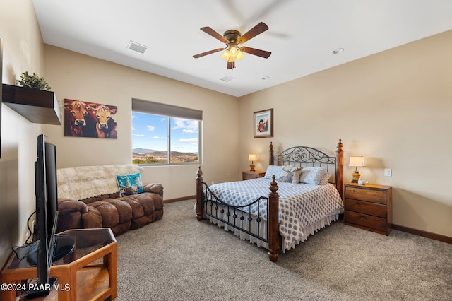 bedroom with ceiling fan and carpet floors