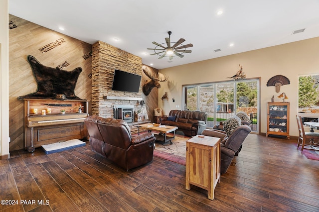 living room with ceiling fan and dark hardwood / wood-style flooring