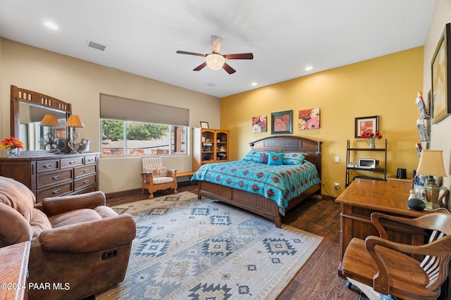 bedroom featuring ceiling fan and dark wood-type flooring