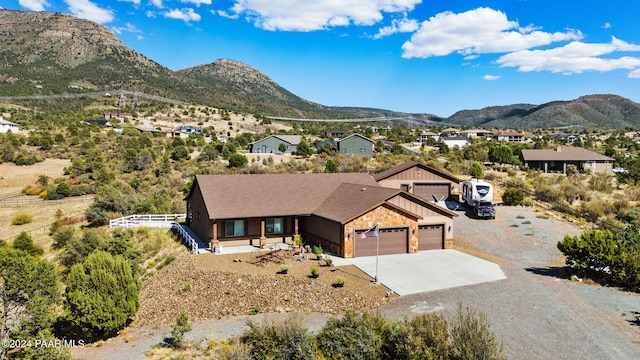 view of front of property featuring a mountain view and a garage