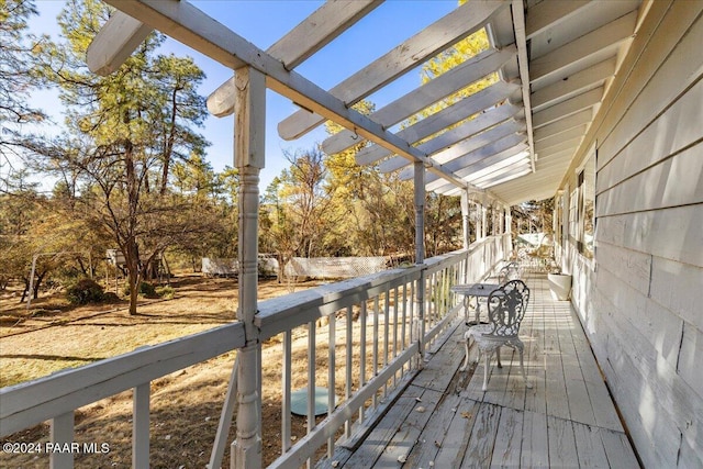 wooden deck featuring a pergola