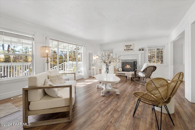 interior space featuring plenty of natural light and a brick fireplace