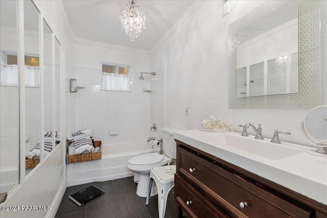 full bathroom featuring tiled shower / bath combo, a notable chandelier, toilet, vanity, and ornamental molding