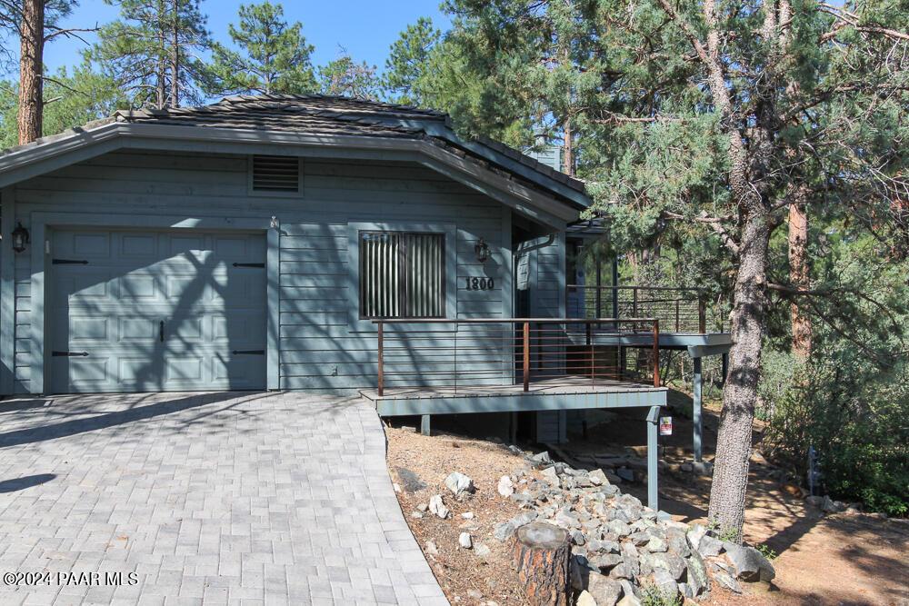 view of side of home with a garage