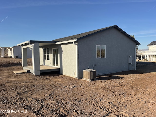 view of property exterior featuring central AC and stucco siding